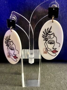 White Oval Artistic Face Dangle Earrings with Black Accent